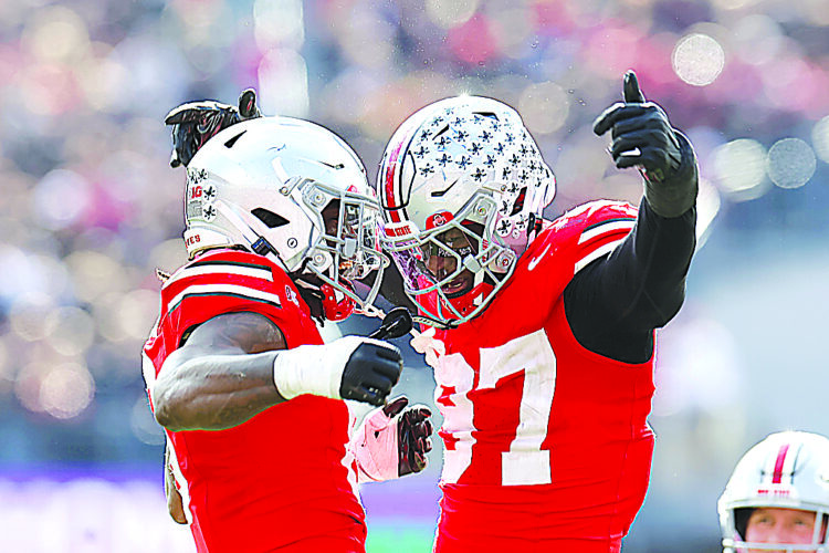 Ohio State’s rebuilt defense depends on versatile stars Reese and Downs